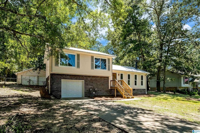 941 Honeysuckle Ln, Moody, AL 35094 - split level home featuring a garage, brick siding, and concrete driveway
