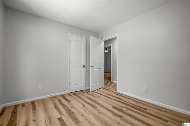 941 Honeysuckle Ln, Moody, AL 35094 - unfurnished bedroom featuring baseboards and light wood finished floors
