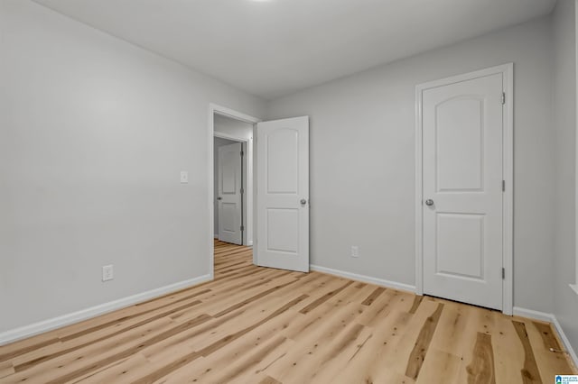 941 Honeysuckle Ln, Moody, AL 35094 - unfurnished bedroom with baseboards and wood finished floors