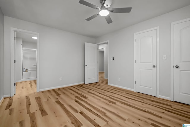 941 Honeysuckle Ln, Moody, AL 35094 - unfurnished bedroom with light wood-style floors, baseboards, connected bathroom, and a ceiling fan