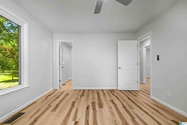 941 Honeysuckle Ln, Moody, AL 35094 - unfurnished bedroom with baseboards, light wood-style floors, and ceiling fan