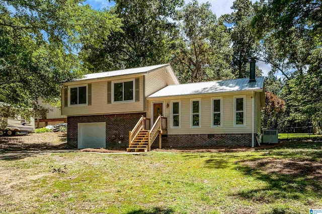 941 Honeysuckle Ln, Moody, AL 35094 - split level home with a garage, a front lawn, and metal roof