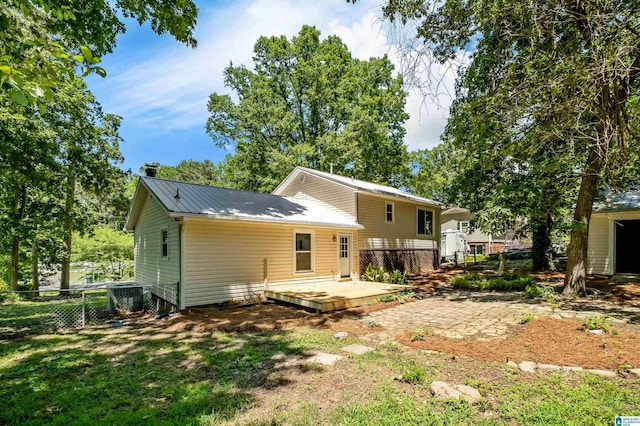 941 Honeysuckle Ln, Moody, AL 35094 - back of property featuring a deck, metal roof, and central air condition unit