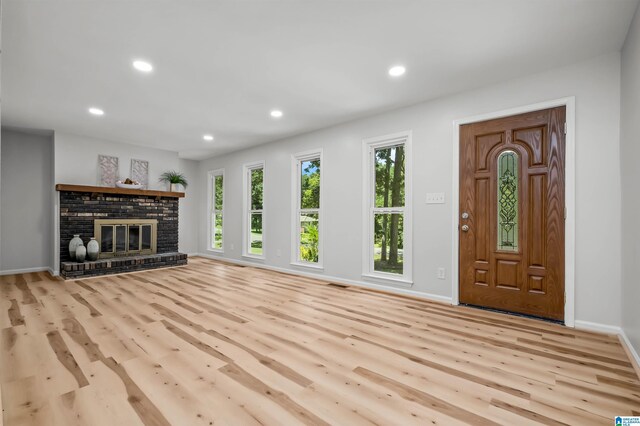941 Honeysuckle Ln, Moody, AL 35094 - unfurnished living room featuring wood finished floors, recessed lighting, baseboards, and a brick fireplace