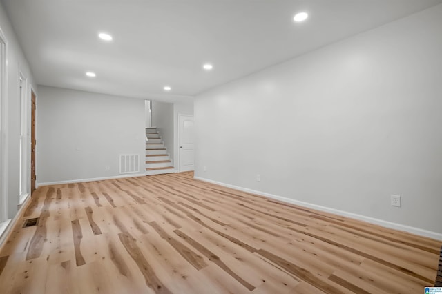 941 Honeysuckle Ln, Moody, AL 35094 - spare room featuring stairway, recessed lighting, light wood finished floors, and baseboards
