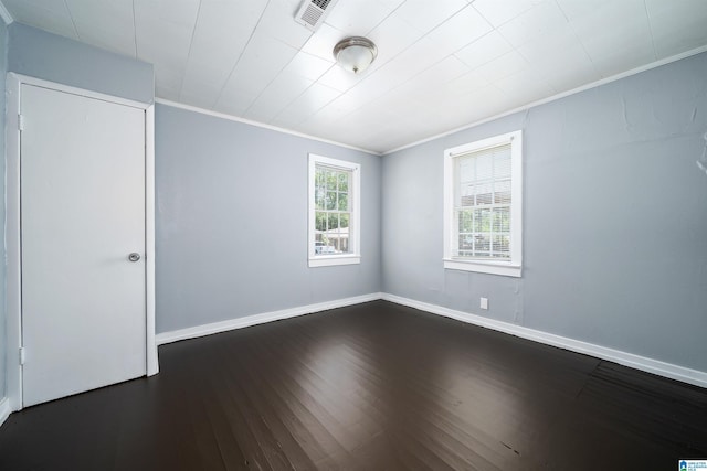 1228 19th Pl SW, Birmingham, AL 35211 - empty room featuring ornamental molding, baseboards, and dark wood-style floors
