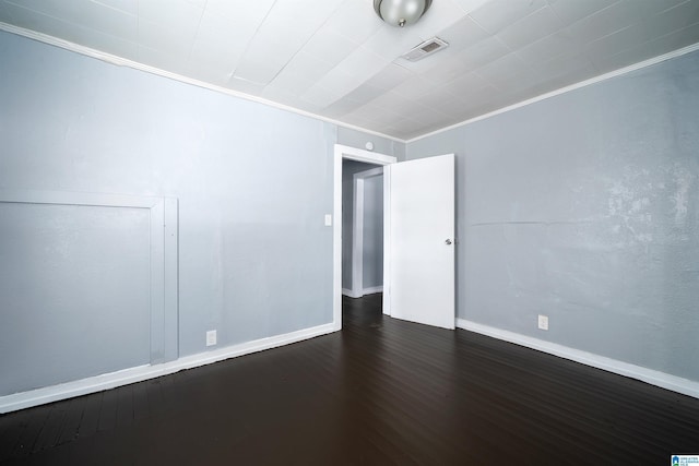 1228 19th Pl SW, Birmingham, AL 35211 - empty room with ornamental molding, dark wood-style floors, and baseboards
