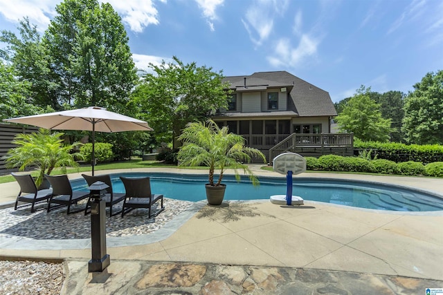 1020 Dunsmore Dr, Chelsea, AL 35043 - outdoor pool with a sunroom, a wooden deck, and a patio area