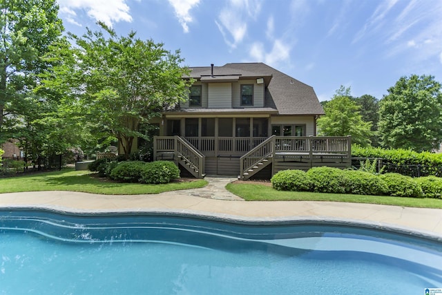 1020 Dunsmore Dr, Chelsea, AL 35043 - rear view of property with stairway, a sunroom, a wooden deck, an outdoor pool, and a shingled roof
