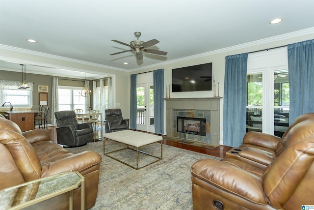 1020 Dunsmore Dr, Chelsea, AL 35043 - living room with ceiling fan, plenty of natural light, ornamental molding, a tile fireplace, and recessed lighting