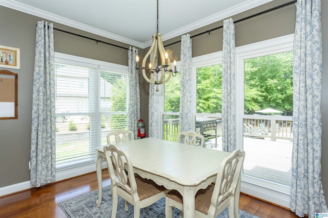 1020 Dunsmore Dr, Chelsea, AL 35043 - dining area featuring a chandelier, plenty of natural light, wood finished floors, crown molding, and baseboards