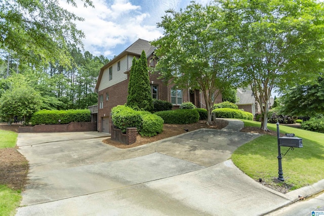 1020 Dunsmore Dr, Chelsea, AL 35043 - view of front facade featuring brick siding, driveway, an attached garage, and a front yard