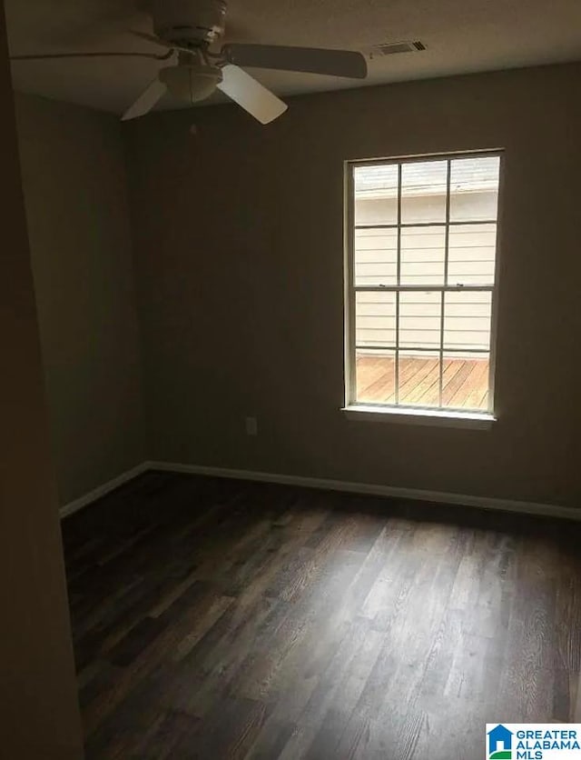 421 Valley Crest Dr, Birmingham, AL 35215 - spare room with ceiling fan, dark wood-style floors, and baseboards