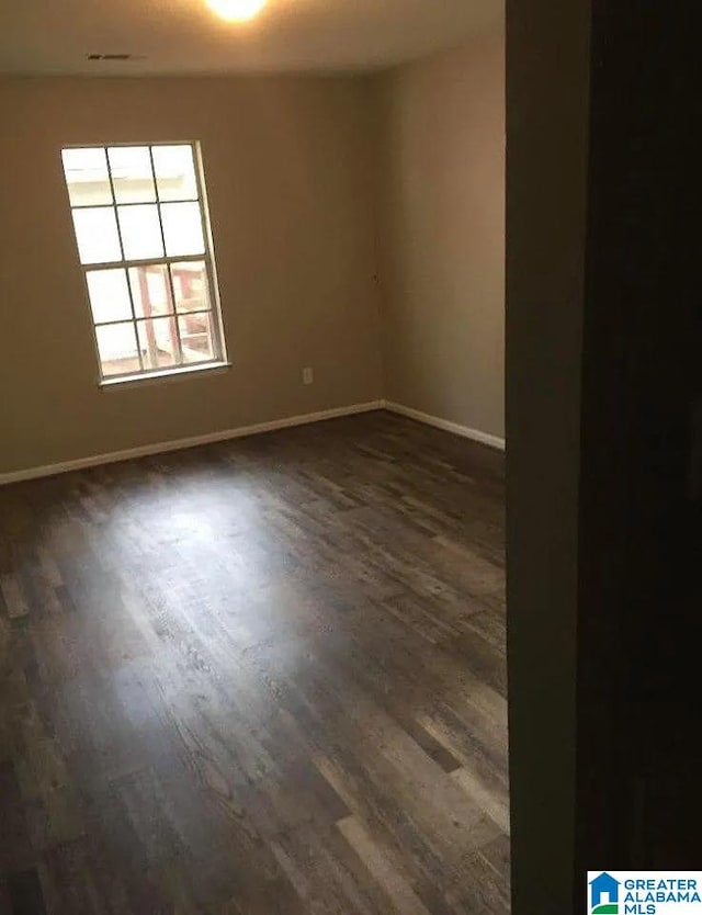 421 Valley Crest Dr, Birmingham, AL 35215 - unfurnished room featuring dark wood-type flooring and baseboards