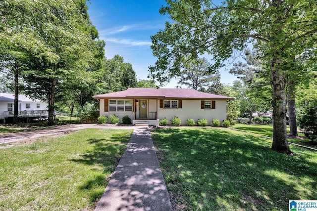 1115 Park Ave, Oneonta, AL 35121 - ranch-style house with a front lawn