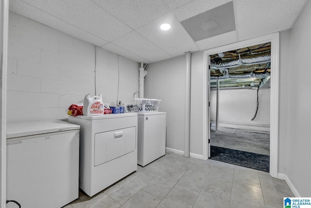 1115 Park Ave, Oneonta, AL 35121 - washroom with separate washer and dryer, concrete block wall, and baseboards