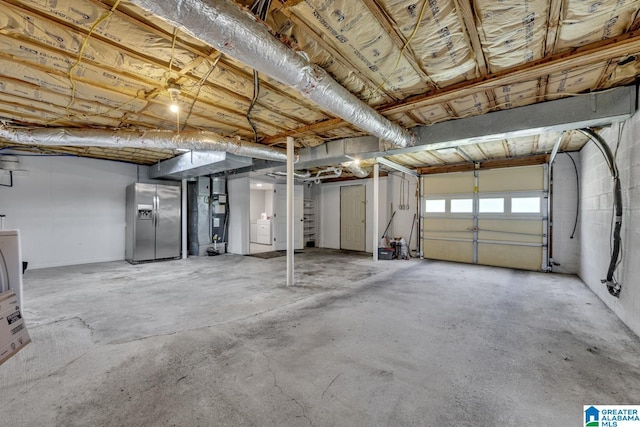 1115 Park Ave, Oneonta, AL 35121 - garage featuring stainless steel fridge with ice dispenser and heating unit