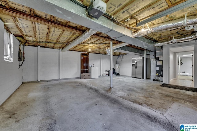 1115 Park Ave, Oneonta, AL 35121 - unfinished basement featuring stainless steel refrigerator with ice dispenser, washer / clothes dryer, electric water heater, and heating unit