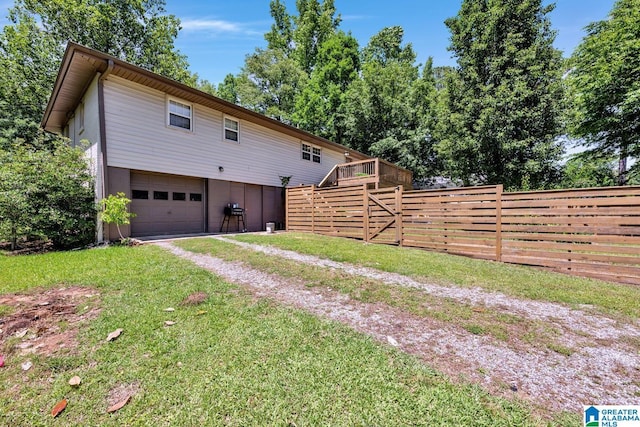1115 Park Ave, Oneonta, AL 35121 - view of side of property with dirt driveway, a garage, stairs, and a deck