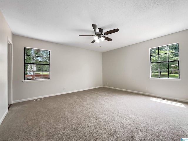 1012 Christopher Dr, Birmingham, AL 35215 - empty room featuring carpet flooring, ceiling fan, baseboards, and a textured ceiling