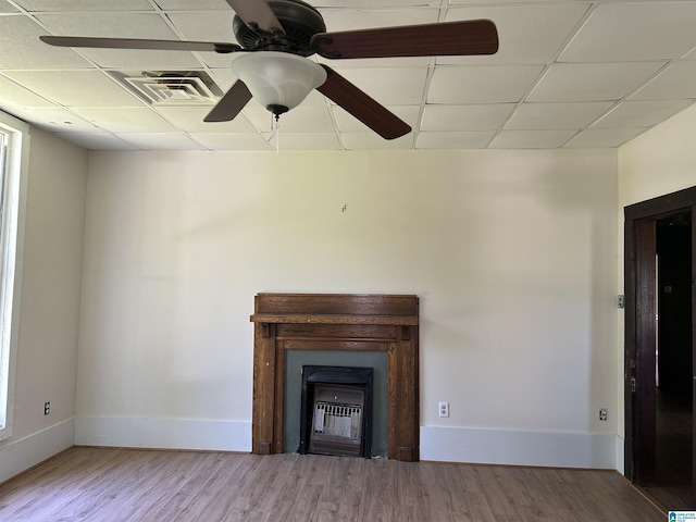 120 2nd St, Jemison, AL 35085 - unfurnished living room with a paneled ceiling, a glass covered fireplace, baseboards, wood finished floors, and ceiling fan