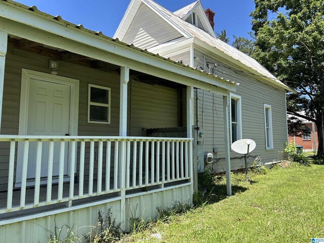 120 2nd St, Jemison, AL 35085 - view of side of property featuring a chimney, a yard, and a porch