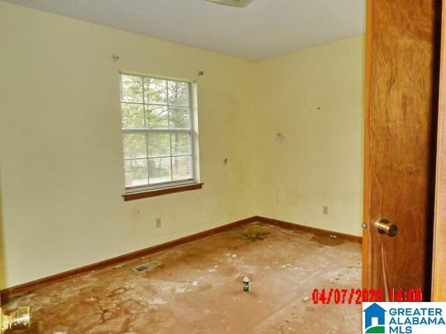 8421 Azalea Dr, Pinson, AL 35126 - spare room featuring baseboards