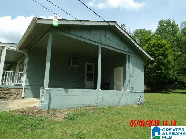 8421 Azalea Dr, Pinson, AL 35126 - view of home's exterior featuring a lawn and an AC wall unit