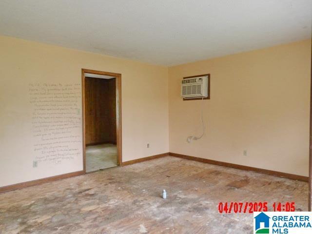 8421 Azalea Dr, Pinson, AL 35126 - spare room with a wall unit AC and baseboards