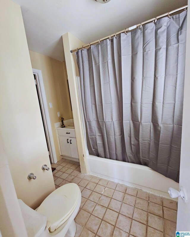 1332 4th Way NW, Center Point, AL 35215 - bathroom featuring toilet, vanity, shower / bath combo with shower curtain, and tile patterned floors