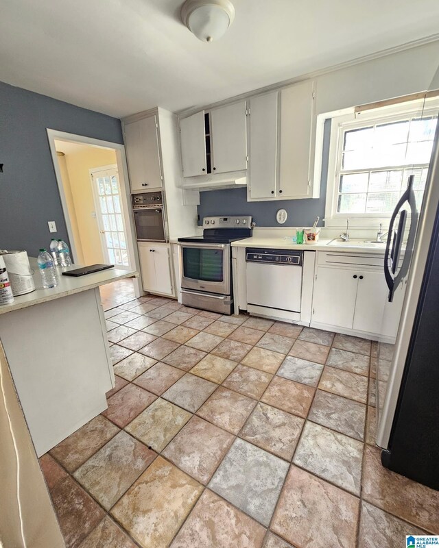 1332 4th Way NW, Center Point, AL 35215 - kitchen featuring stainless steel electric range, dishwasher, plenty of natural light, and under cabinet range hood