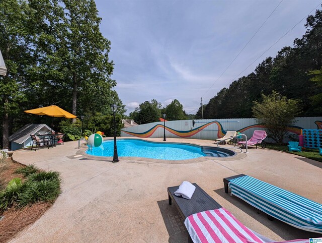 967 Wright Way Dr, Wedowee, AL 36278 - view of swimming pool with a water slide and a patio