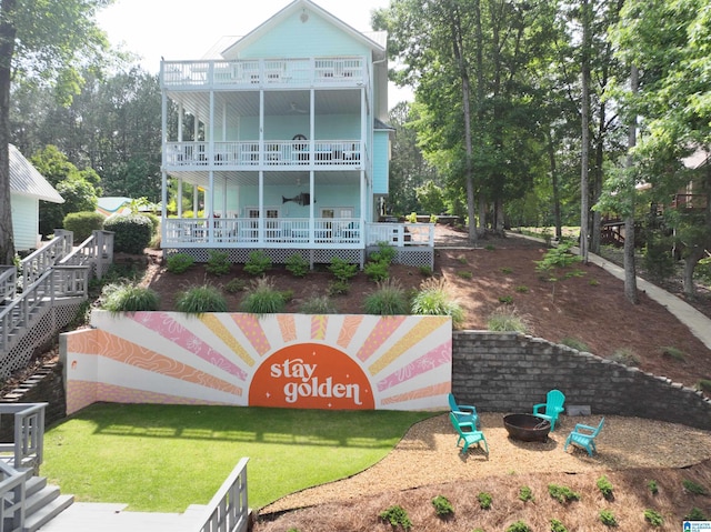 967 Wright Way Dr, Wedowee, AL 36278 - rear view of property featuring a balcony, a fire pit, a yard, and a ceiling fan