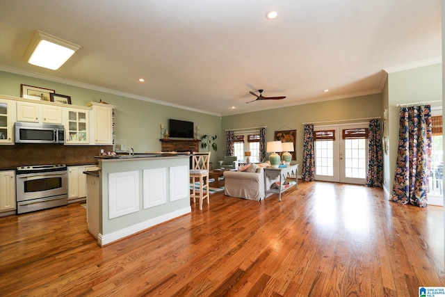 967 Wright Way Dr, Wedowee, AL 36278 - kitchen featuring stainless steel appliances, dark countertops, open floor plan, plenty of natural light, and recessed lighting