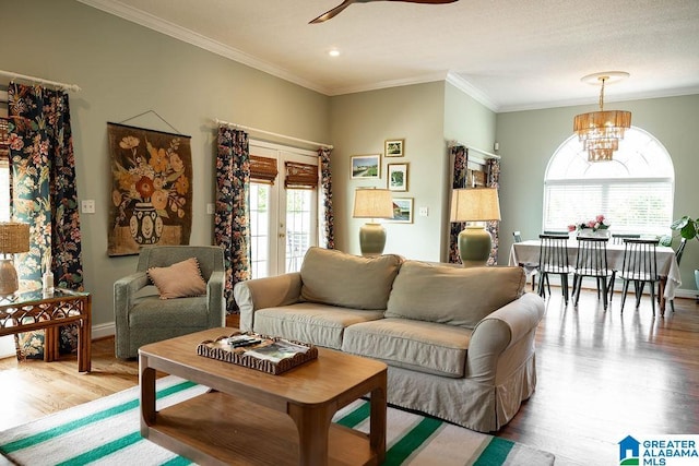 967 Wright Way Dr, Wedowee, AL 36278 - living area featuring ceiling fan, crown molding, wood finished floors, a chandelier, and baseboards