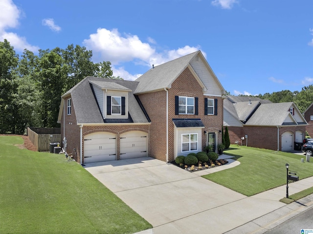 6303 Letson Farms Dr, Bessemer, AL 35022 - traditional-style house featuring driveway, a front yard, brick siding, and roof with shingles