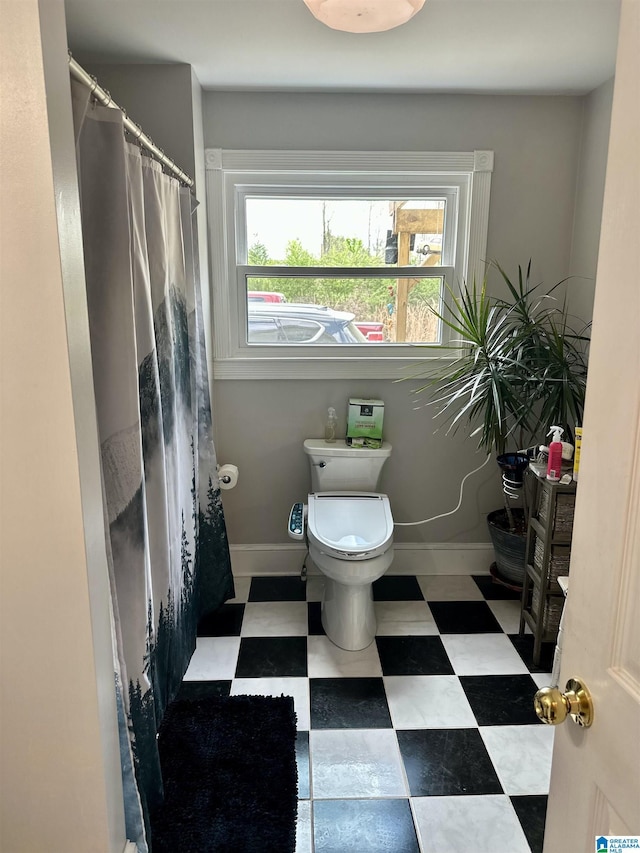 12325 US Highway 411 N, Centre, AL 35960 - bathroom with toilet, baseboards, tile patterned floors, and curtained shower