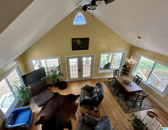 12325 US Highway 411 N, Centre, AL 35960 - living room with a ceiling fan, high vaulted ceiling, healthy amount of natural light, baseboards, and a chandelier