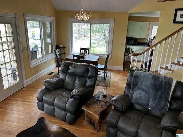 12325 US Highway 411 N, Centre, AL 35960 - living room featuring vaulted ceiling, plenty of natural light, and light wood finished floors