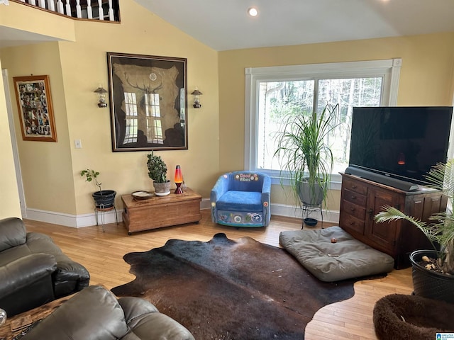 12325 US Highway 411 N, Centre, AL 35960 - living area featuring baseboards, wood finished floors, vaulted ceiling, healthy amount of natural light, and recessed lighting