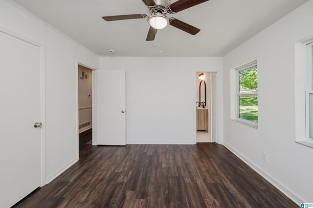 732 Highland Ave, Birmingham, AL 35206 - unfurnished bedroom with wood finished floors, baseboards, ceiling fan, connected bathroom, and ornamental molding