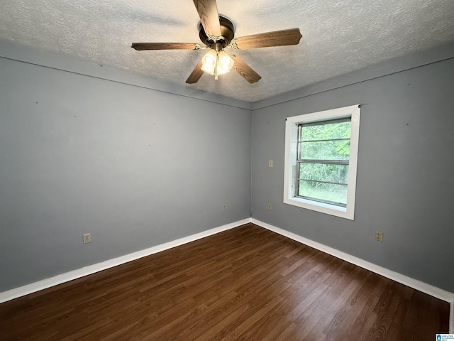 1790 Mount View Rd, Wellington, AL 36279 - unfurnished room with a textured ceiling, dark wood-style flooring, baseboards, and ceiling fan