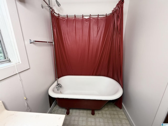 1790 Mount View Rd, Wellington, AL 36279 - bathroom with a freestanding tub, baseboards, and tile patterned floors
