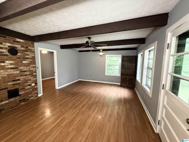 1790 Mount View Rd, Wellington, AL 36279 - unfurnished living room with baseboards, a textured ceiling, wood finished floors, a ceiling fan, and beamed ceiling