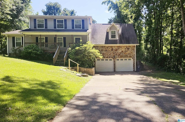 7371 Thomas Hall Dr, Trussville, AL 35173 - view of front of house with asphalt driveway, a porch, stone siding, stairs, and a front lawn