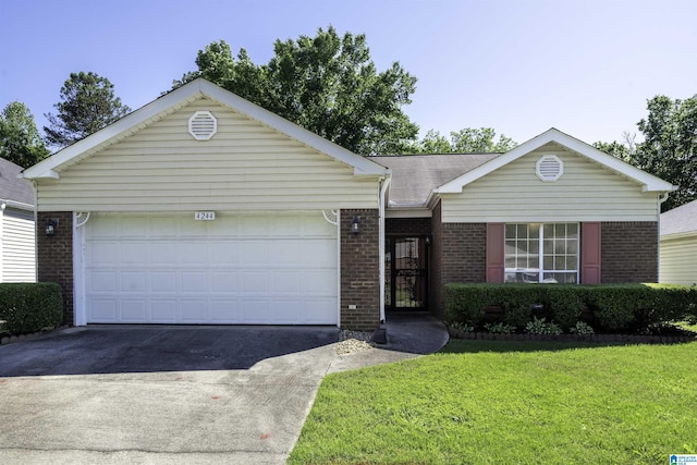 4244 Cobblestone Ct, Pinson, AL 35126 - single story home with brick siding, asphalt driveway, a front lawn, and an attached garage