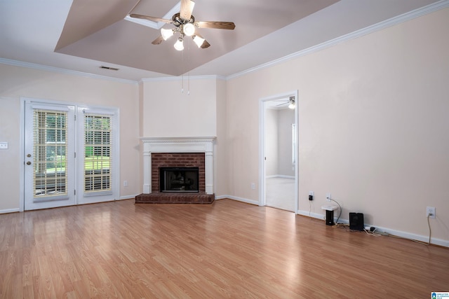 4244 Cobblestone Ct, Pinson, AL 35126 - unfurnished living room featuring ceiling fan, light wood-type flooring, crown molding, baseboards, and a fireplace