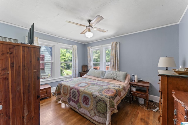 784 80th St, Birmingham, AL 35206 - bedroom with wood finished floors, crown molding, baseboards, and ceiling fan