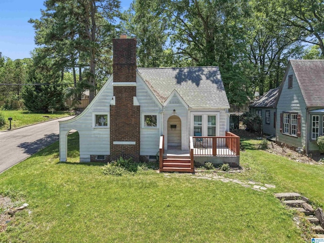784 80th St, Birmingham, AL 35206 - tudor home with a chimney, a front lawn, crawl space, and a deck