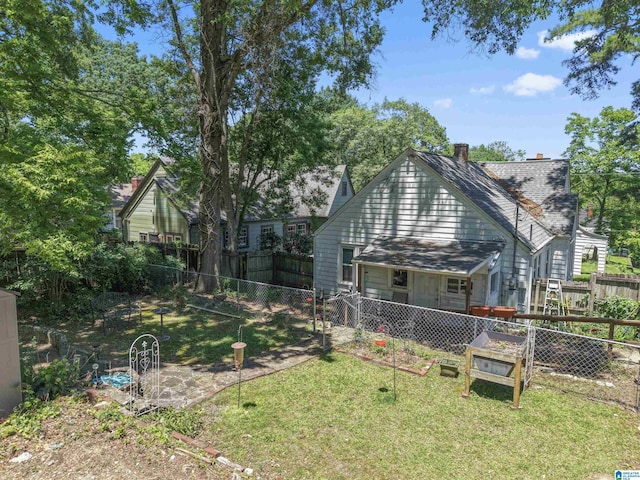 784 80th St, Birmingham, AL 35206 - back of house featuring a chimney